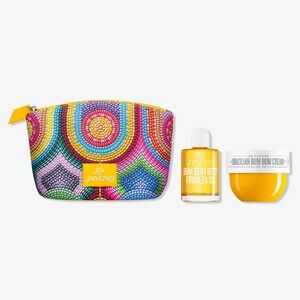 Sol De Janeiro cosmetic bag with body oil and bum bum cream.